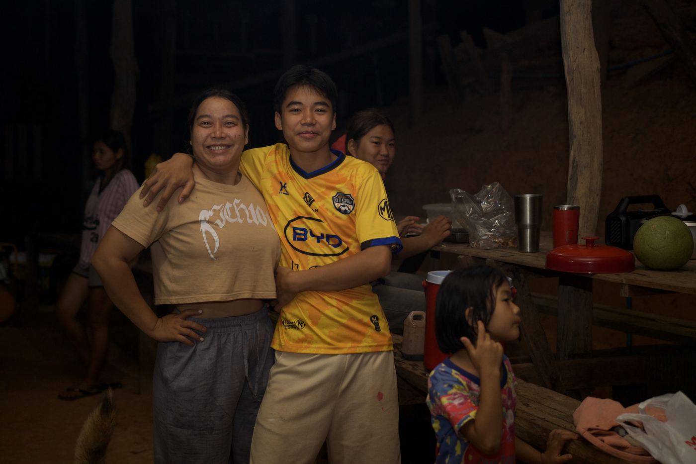 Villagers and guests gathered around the evening dinner table